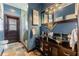 Modern bathroom with glass-topped vanity and walk-in shower at 9227 Cypress Cove Dr, Orlando, FL 32819