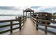 Private boat dock with gazebo and waterfront views at 9227 Cypress Cove Dr, Orlando, FL 32819