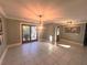 Bright dining room with tiled floors, french doors, and a chandelier at 9227 Cypress Cove Dr, Orlando, FL 32819