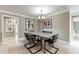 Bright dining room with table and chairs, adjacent to kitchen at 9227 Cypress Cove Dr, Orlando, FL 32819