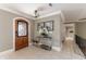 Elegant entryway with wood door, tile flooring and stylish console table at 9227 Cypress Cove Dr, Orlando, FL 32819