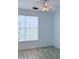 Bright bedroom features a large window and ceiling fan at 3176 Feltrim Pl # 305, Kissimmee, FL 34747