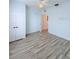 Well-lit bedroom features hardwood floors, and closet at 3176 Feltrim Pl # 305, Kissimmee, FL 34747