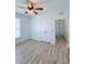 Bedroom includes hardwood floors, closet, and ceiling fan at 3176 Feltrim Pl # 305, Kissimmee, FL 34747