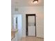 Laundry closet area featuring a stacked washer and dryer at 3176 Feltrim Pl # 305, Kissimmee, FL 34747