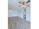 An open-concept living room with light wood floors and plenty of natural light at 3176 Feltrim Pl # 305, Kissimmee, FL 34747