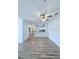Spacious living room showcasing light wood floors and a ceiling fan at 3176 Feltrim Pl # 305, Kissimmee, FL 34747