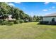 Expansive grassy backyard, partially fenced, next to home at 32619 View Haven Ln, Sorrento, FL 32776