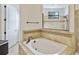 Bathroom with soaking tub, shower, and tiled flooring at 32619 View Haven Ln, Sorrento, FL 32776
