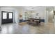 Bright dining room with a wooden table and blue accents at 32619 View Haven Ln, Sorrento, FL 32776