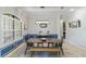 Dining area with a long wooden table and stylish light fixture at 32619 View Haven Ln, Sorrento, FL 32776