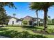 Single-story home with stone accents and palm trees at 32619 View Haven Ln, Sorrento, FL 32776