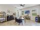 Home bar with ample shelving and seating for entertaining at 32619 View Haven Ln, Sorrento, FL 32776
