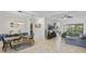 Open living room and dining area with large sectional sofa at 32619 View Haven Ln, Sorrento, FL 32776
