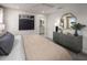 Calm bedroom with neutral tones, dresser with decor, and a glimpse into the en-suite bathroom at 3221 Douglas Fir Dr, Apopka, FL 32703