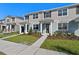 Charming townhouse with a well-manicured lawn and inviting entrance, perfect for modern living at 3225 Douglas Fir Dr, Apopka, FL 32703