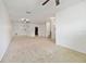 Spacious living room with neutral carpeting and ceiling fans at 1654 Buckeye Falls Way, Orlando, FL 32824