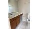 Bathroom featuring a sink and toilet with tiled floors at 2444 Summerfield Way # 1, Kissimmee, FL 34741