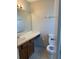 Bathroom features a sink, mirror, toilet, vanity, and tiled floor at 2444 Summerfield Way # 1, Kissimmee, FL 34741