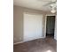 A bedroom featuring a ceiling fan and a large closet at 2444 Summerfield Way # 1, Kissimmee, FL 34741