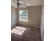 Neutral bedroom with carpet, fan and a large window providing natural light at 2444 Summerfield Way # 1, Kissimmee, FL 34741