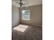 Bedroom featuring a window with natural light and carpeted floor at 2444 Summerfield Way # 1, Kissimmee, FL 34741
