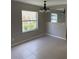Cozy dining area featuring tile flooring, a modern light fixture, and a large mirror at 2444 Summerfield Way # 1, Kissimmee, FL 34741