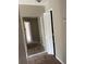 A hallway showcasing closet space and neutral wall colors at 2444 Summerfield Way # 1, Kissimmee, FL 34741