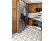 Spacious kitchen with stainless steel appliances, ample cabinetry, and bright tile flooring for a modern look at 2444 Summerfield Way # 1, Kissimmee, FL 34741