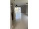 Bright living room featuring tile flooring and sliding glass doors to a patio, offering ample natural light at 2444 Summerfield Way # 1, Kissimmee, FL 34741