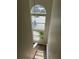 The stairway boasts a high, narrow, multi-paned window and a hanging light fixture at 2444 Summerfield Way # 1, Kissimmee, FL 34741