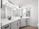 Bright bathroom featuring double sinks, quartz countertops, and modern fixtures at 225 Terrace Hill Blvd # 1C, Debary, FL 32713