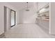 Spacious dining area with sliding glass doors and view to a well-appointed kitchen at 225 Terrace Hill Blvd # 1C, Debary, FL 32713