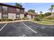 Well-maintained townhome exterior with parking, landscaping, and a welcoming facade at 225 Terrace Hill Blvd # 1C, Debary, FL 32713