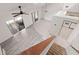Bright, airy living room with tile flooring, ceiling fan, and sliding glass doors at 225 Terrace Hill Blvd # 1C, Debary, FL 32713