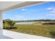 An expansive water view from a concrete patio in the backyard is a delight at 4678 Ackee Rd, Kissimmee, FL 34758