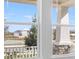 View of the front yard and nearby pond through a window featuring white trim at 4678 Ackee Rd, Kissimmee, FL 34758