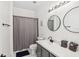 Clean bathroom with shower/tub combo, double vanity, and modern fixtures at 273 Willow View Dr, Davenport, FL 33896
