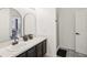 Bathroom with walk-in shower, double vanity, and updated finishes at 273 Willow View Dr, Davenport, FL 33896