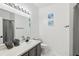 Bathroom with shower, single vanity, and decorative artwork at 273 Willow View Dr, Davenport, FL 33896