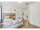 Second bedroom with king-size bed and en-suite bathroom access at 273 Willow View Dr, Davenport, FL 33896
