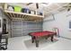 Fun game room with pool table, dartboard, and overhead storage at 273 Willow View Dr, Davenport, FL 33896