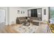Bright and airy living room with sectional sofa and large area rug at 273 Willow View Dr, Davenport, FL 33896