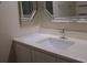 Bathroom vanity with a white countertop, sink, and stylish mirrors at 911 N Orange Ave # 335, Orlando, FL 32801