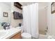 Well-lit bathroom with a shower-tub combo, a vanity with sink, and modern fixtures at 244 Capri Dr, Davenport, FL 33897