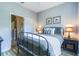 Comfortable bedroom featuring neutral walls, modern lamps, and a decorative bed frame at 244 Capri Dr, Davenport, FL 33897