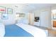 Bright main bedroom with a large dresser, TV, ensuite bathroom, and a large mirror at 244 Capri Dr, Davenport, FL 33897