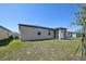 The home features a cozy covered patio overlooking a spacious backyard, ideal for outdoor enjoyment at 3158 Viceroy Ct, Poinciana, FL 34759
