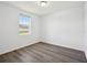 Bright bedroom with a large window and wood flooring offering natural light at 3158 Viceroy Ct, Poinciana, FL 34759