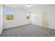 Bedroom with neutral carpet, white walls, and bright windows at 3158 Viceroy Ct, Poinciana, FL 34759